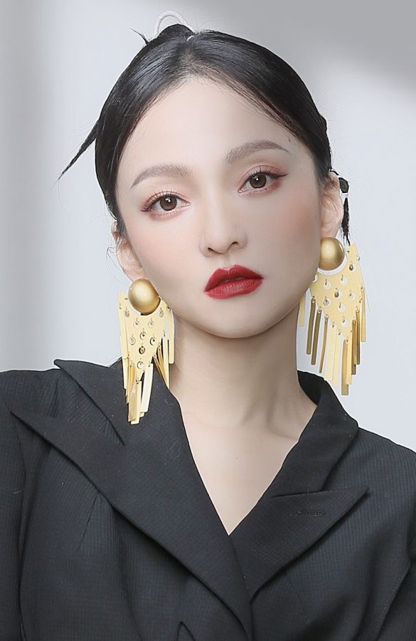 张韶涵靴裤一体包围迷人美腿(4/4)